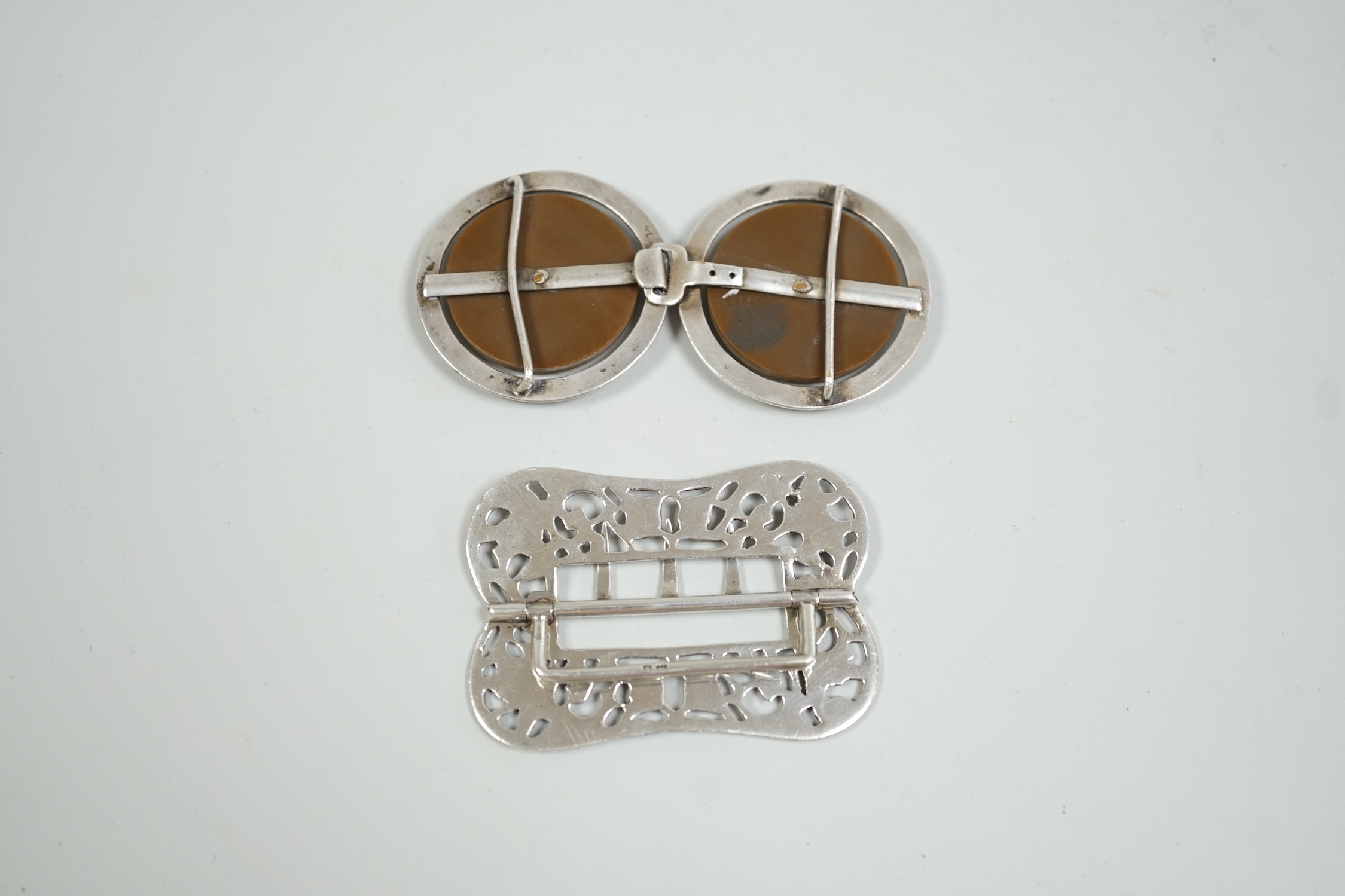 A Victorian silver belt buckle, H & A, Birmingham 1900, and a continental white metal mounted two piece belt buckle